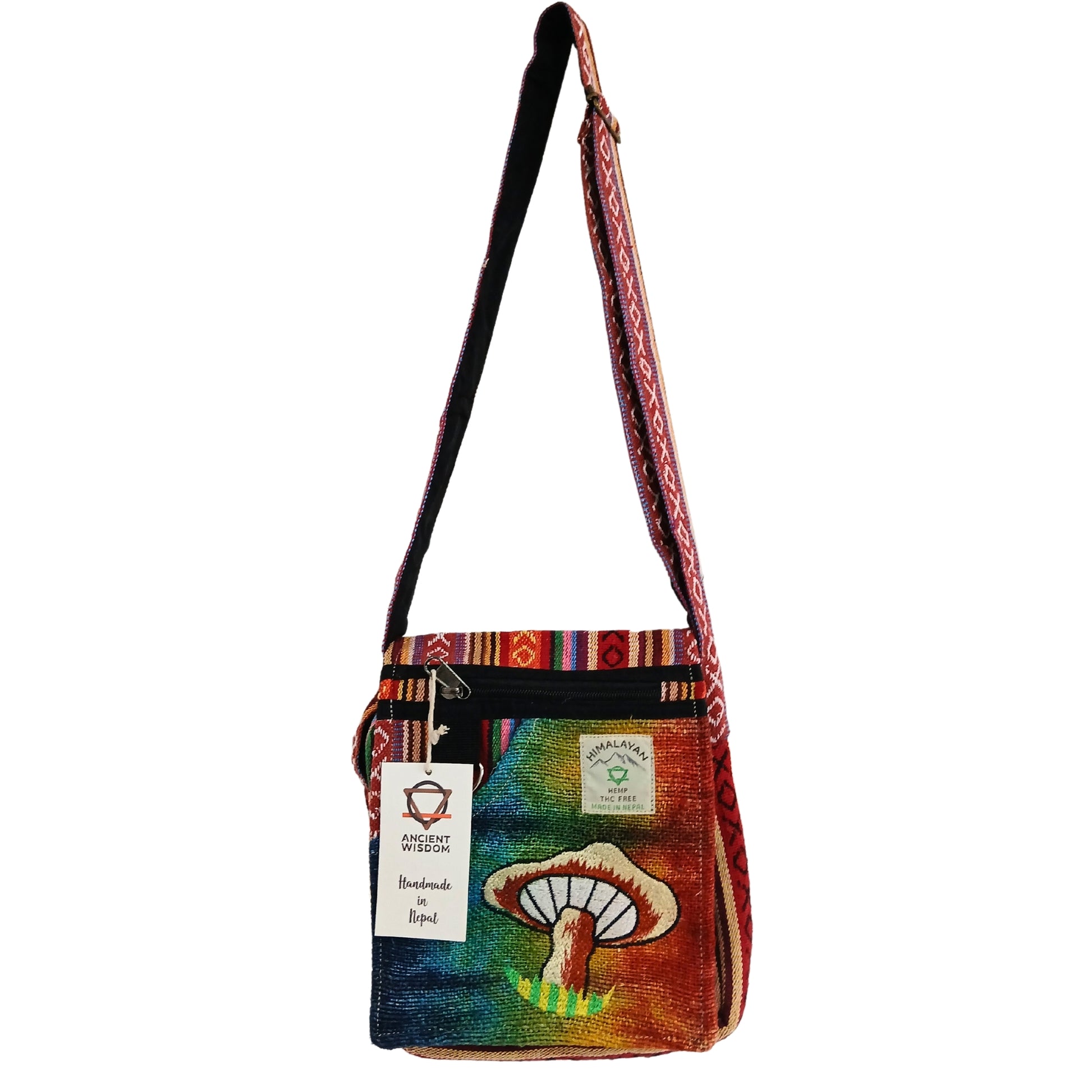 Colorful shoulder bag with mushroom design and brand label on a white background