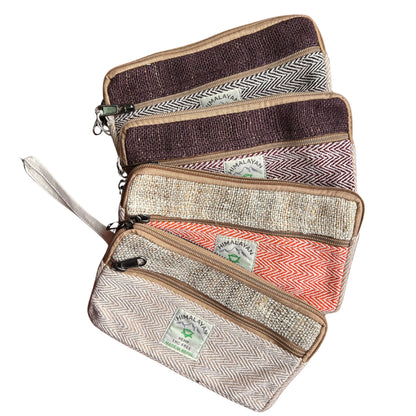 Set of four patterned pouches with visible brand labels on a white background