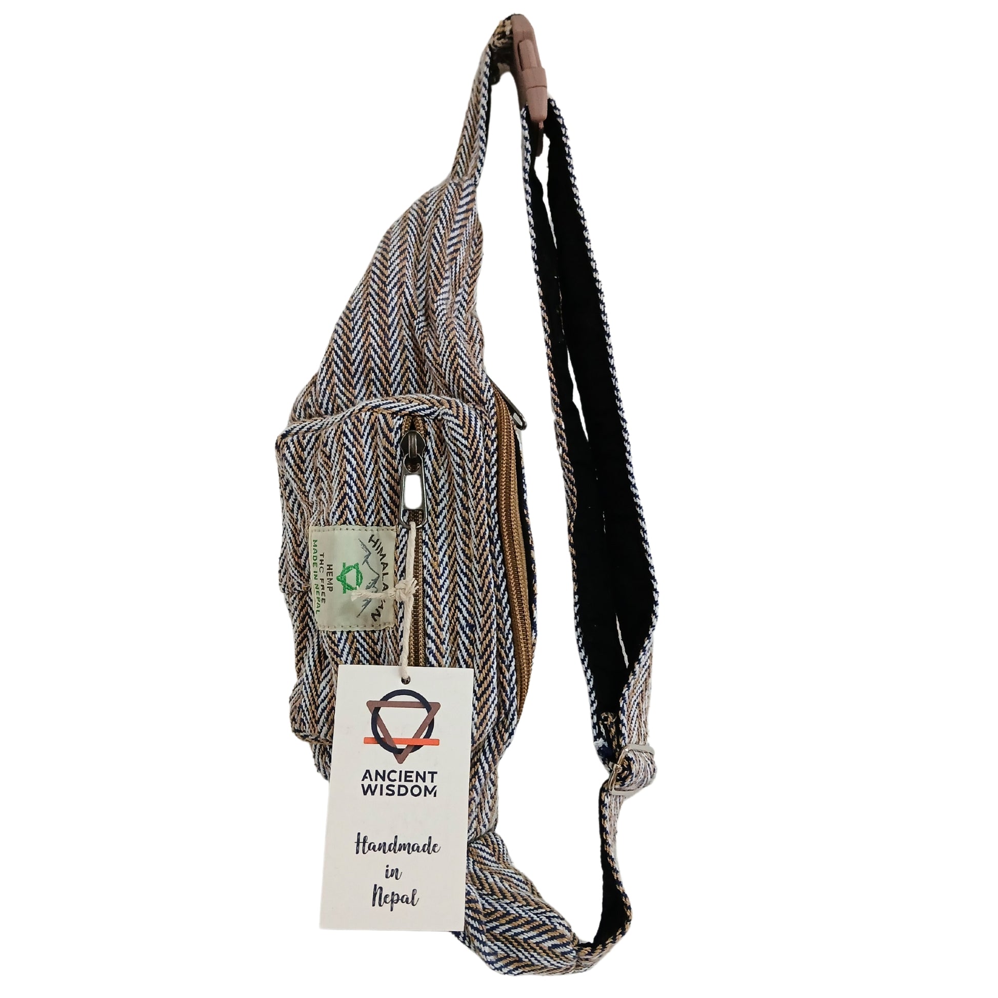 Handmade sling bag with a visible brand tag on a white background