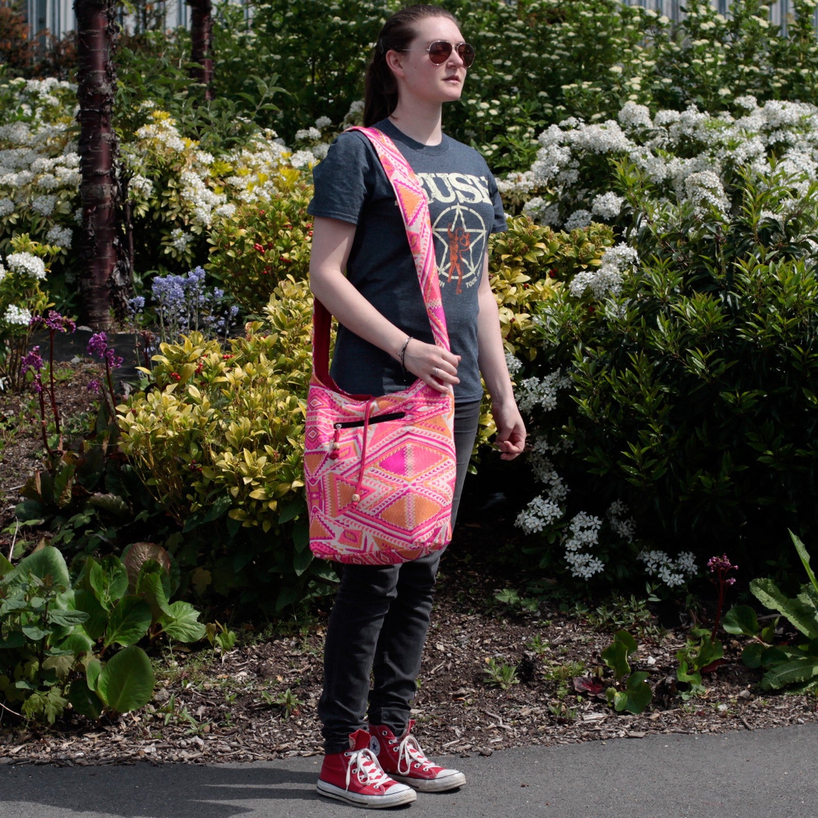 women wearing her Kathmandu Big Bag - Sunset over her shoulder