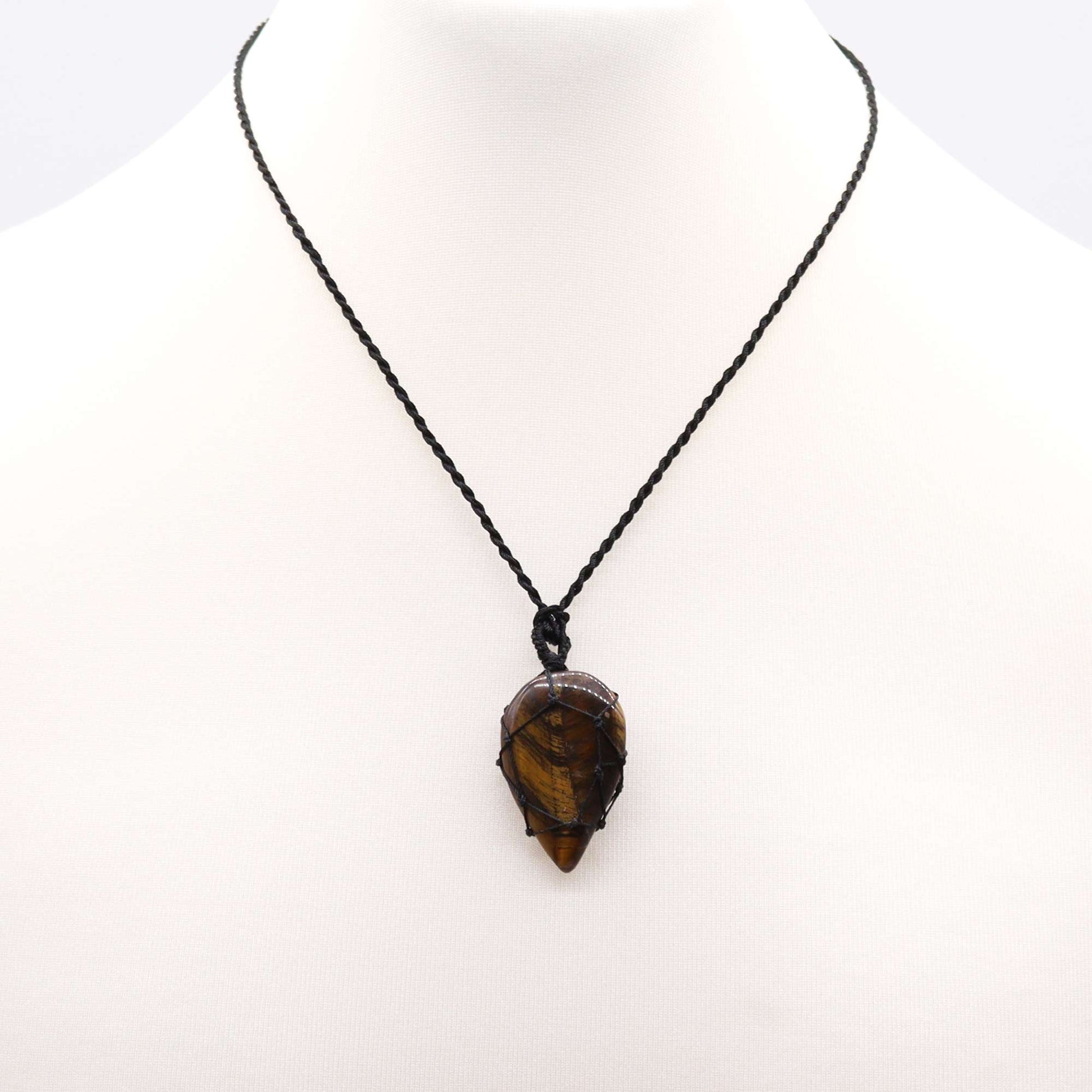 Necklace with a tiger's eye  Tear drop pendant on a white background