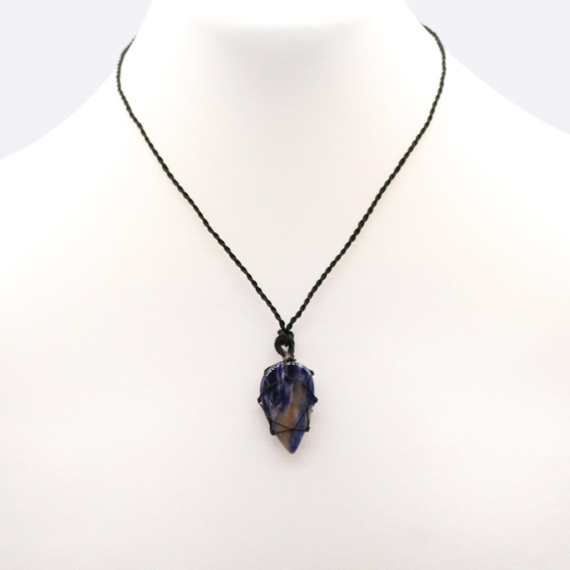 Necklace with a dark blue Laced Laced Gemstone Teardrop Pendant - Sodalite- Golden Quartz on a white background