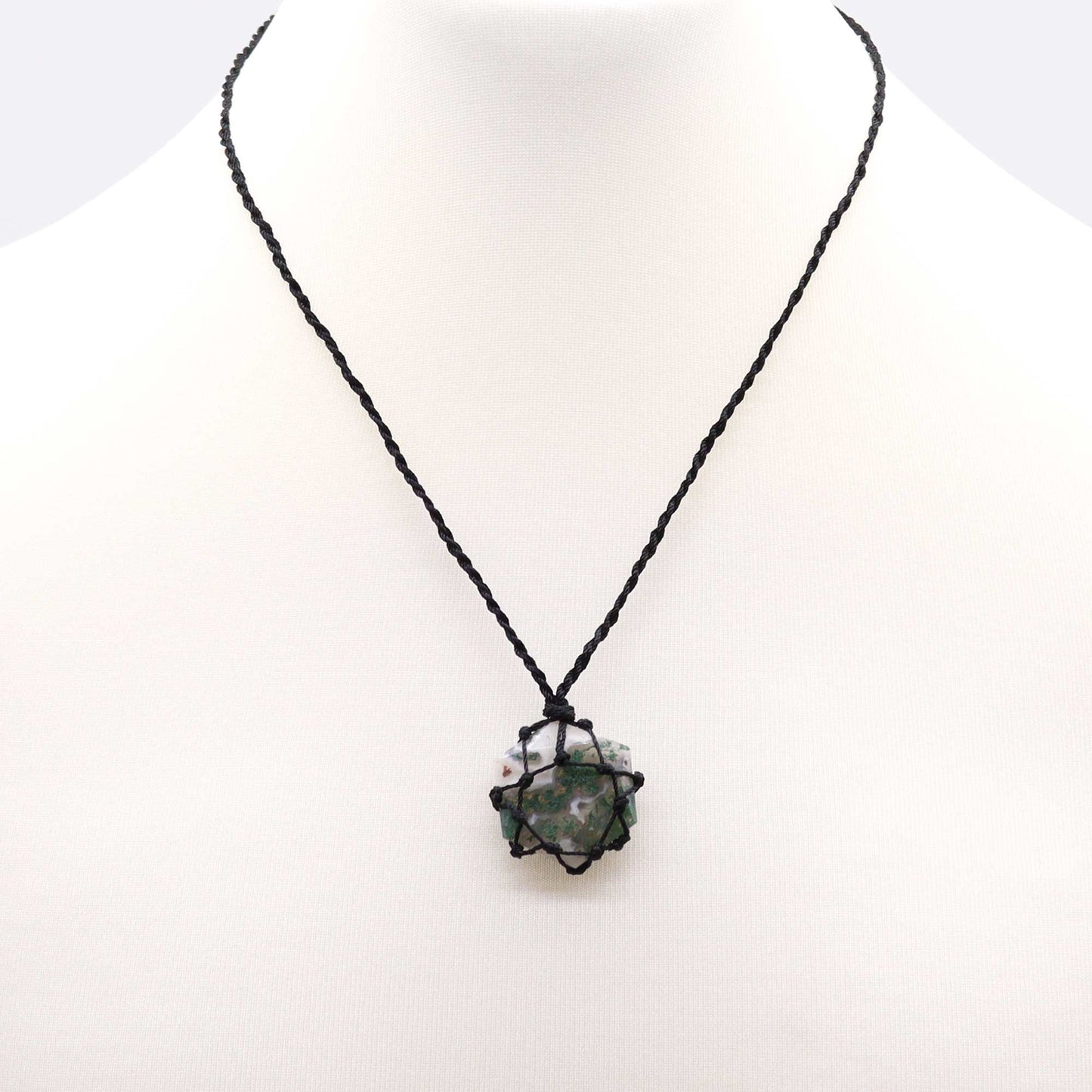Necklace with a black cord and Laced Gemstone Hexagon Pendant - Moss Agate on a white background