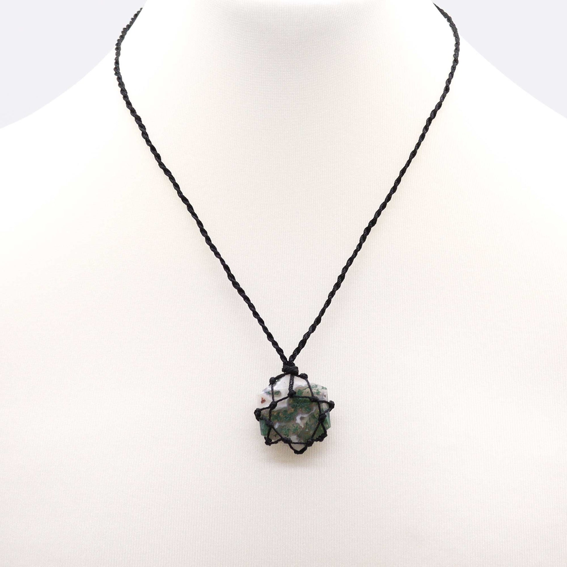 Necklace with a black cord and Laced Gemstone Hexagon Pendant - Moss Agate on a white background