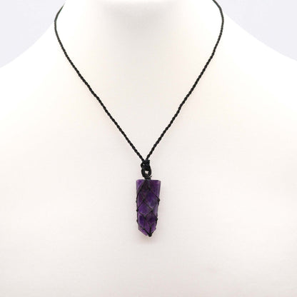 Amethyst pencil pendant necklace on a white background