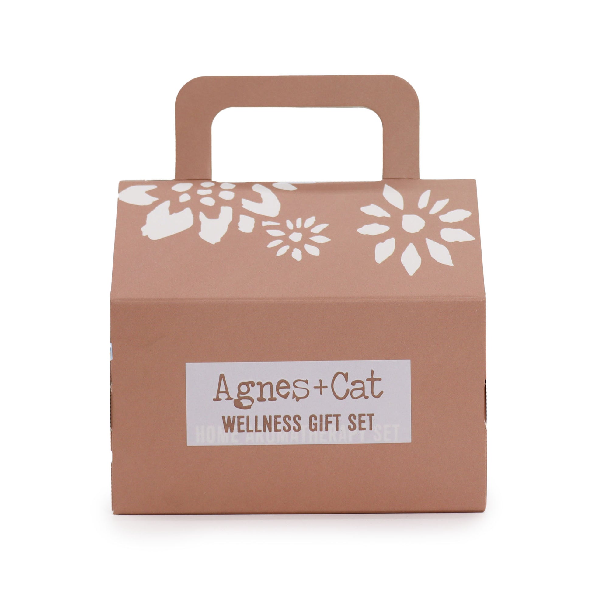 Brown gift box with floral designs and 'Agnes + Cat Wellness Gift Set' label on a white background