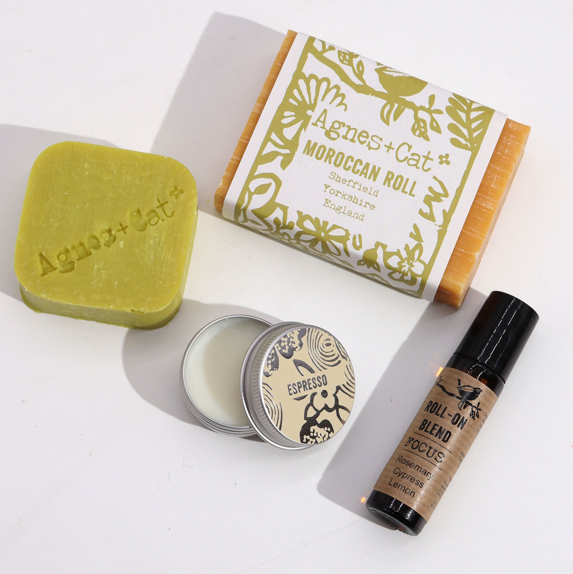 Moroccan Roll Collection of Agnes + Cat products including soap, candle, and roll-on blend on a white background