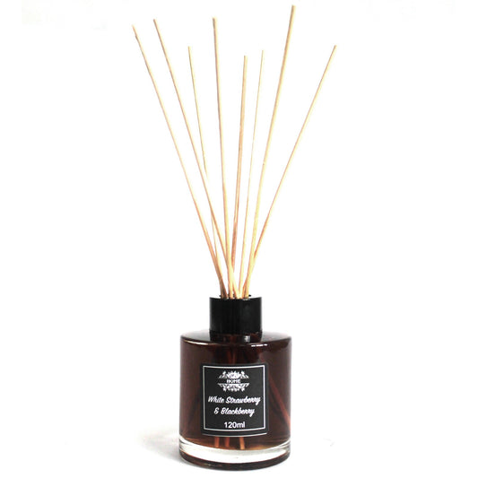 Reed diffuser with wooden sticks in a black bottle on a white background