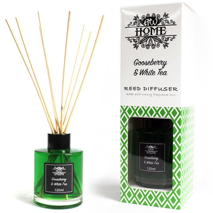 Gooseberry & white tea, Green reed diffuser with wooden sticks and packaging labeled 'At Home' on a white background