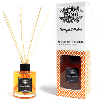 Orange & Melon Reed diffuser with orange and melon scent next to its packaging on a white background