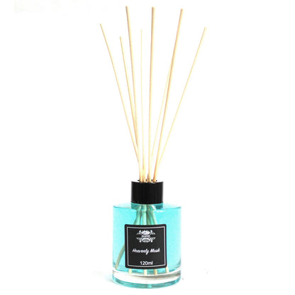 Heavenly MuskReed diffuser with wooden sticks in a clear bottle on a white background
