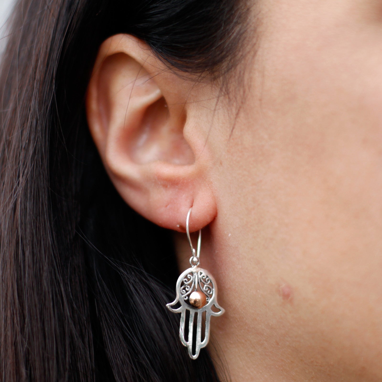 close up of Silver & Gold Earring - Hamsa Specifications: * Height with Drop: 2.5cm * Fitting: Hook  * Metal : 18k Gold  & 925 Silver * Weight: 1 gram (together)