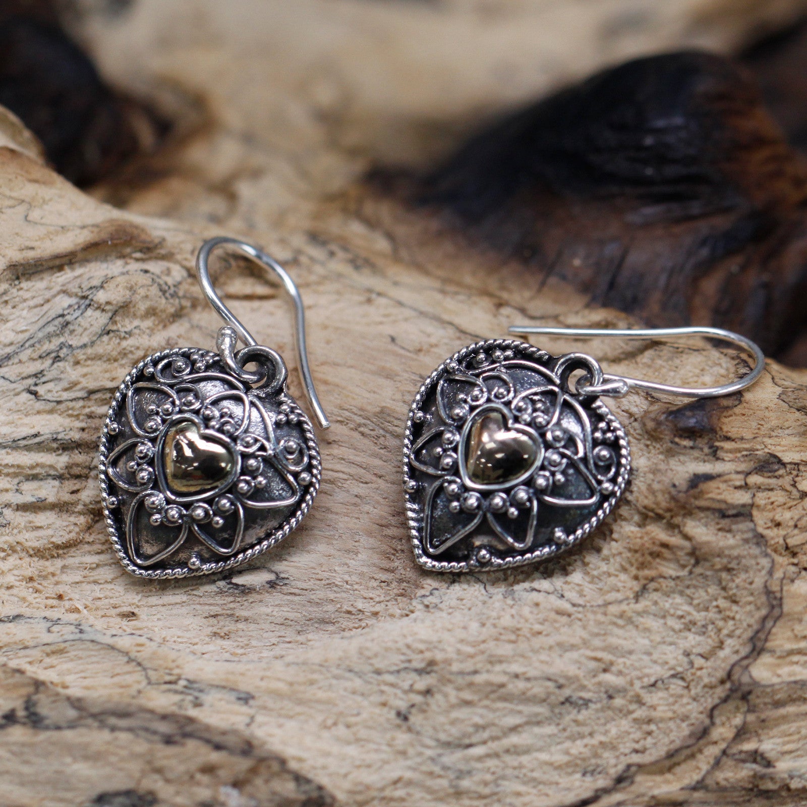 lying on log. -  Silver & Gold Earring - Mandala Hearts * Height with Drop: 3.2cm * Fitting: Hook * Metal: 18k Gold & 925 Silver * Weight: 3 grams (combined)