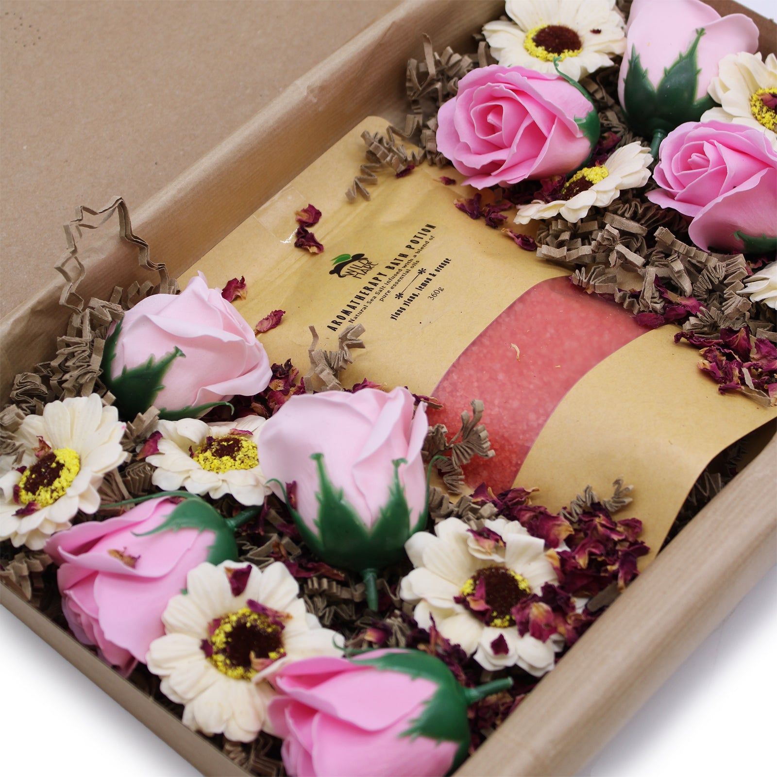 close up shot of Passion Set A 350g Bath Salt infused with Ylang Ylang, Lemon, and Orange.  8 Soap Roses.  8 Soap Sunflowers.