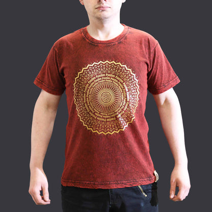 Red t-shirt with a gold mandala design worn by a person on a dark background
