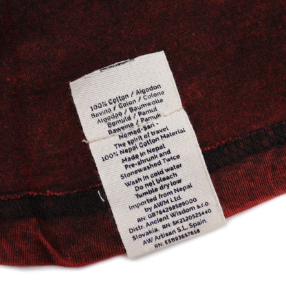 Clothing label on a red fabric background