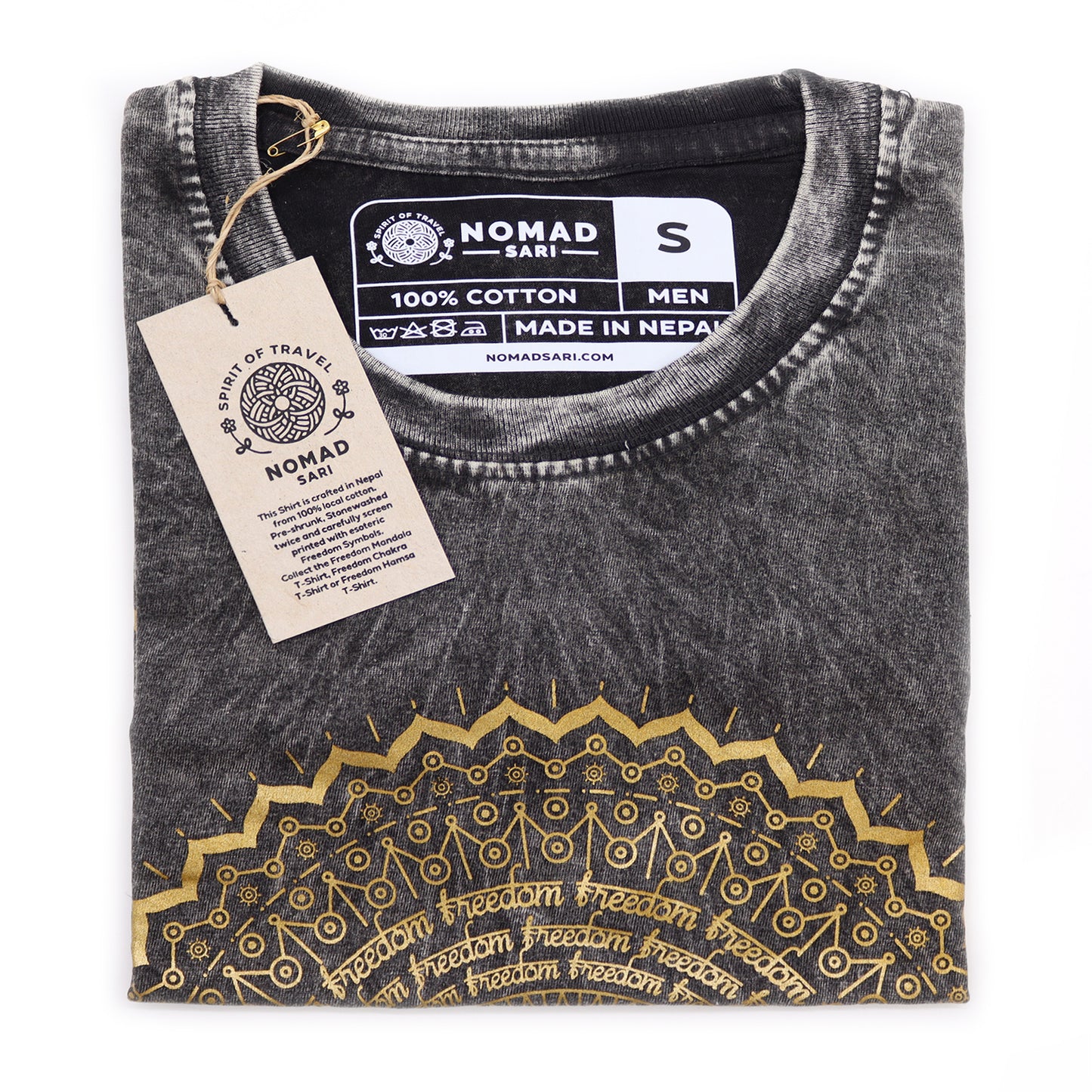 Folded black t-shirt with gold embroidery and 'Nomad Sari' tag on a white background
