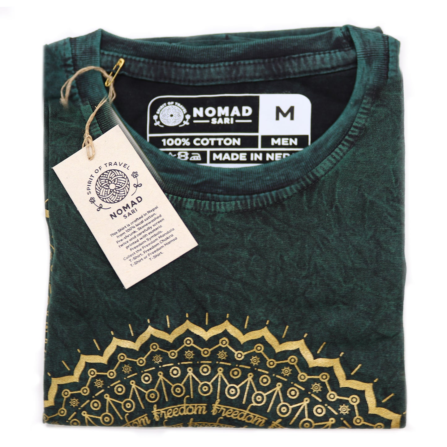 Green t-shirt with gold embroidery and 'Nomad' label on a white background