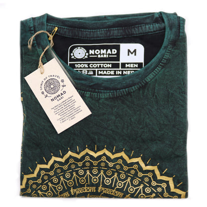 Green t-shirt with gold embroidery and 'Nomad' label on a white background