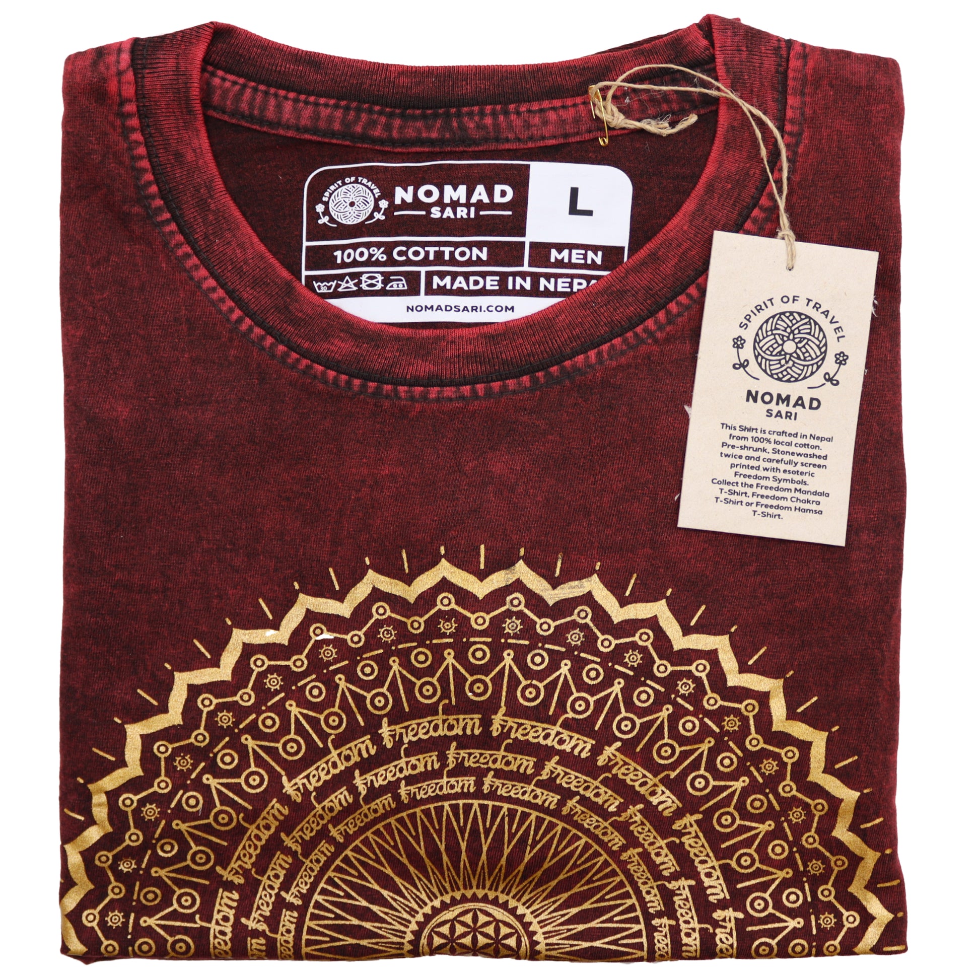 Folded maroon t-shirt with gold design and 'Nomad Sari' label on a white background
