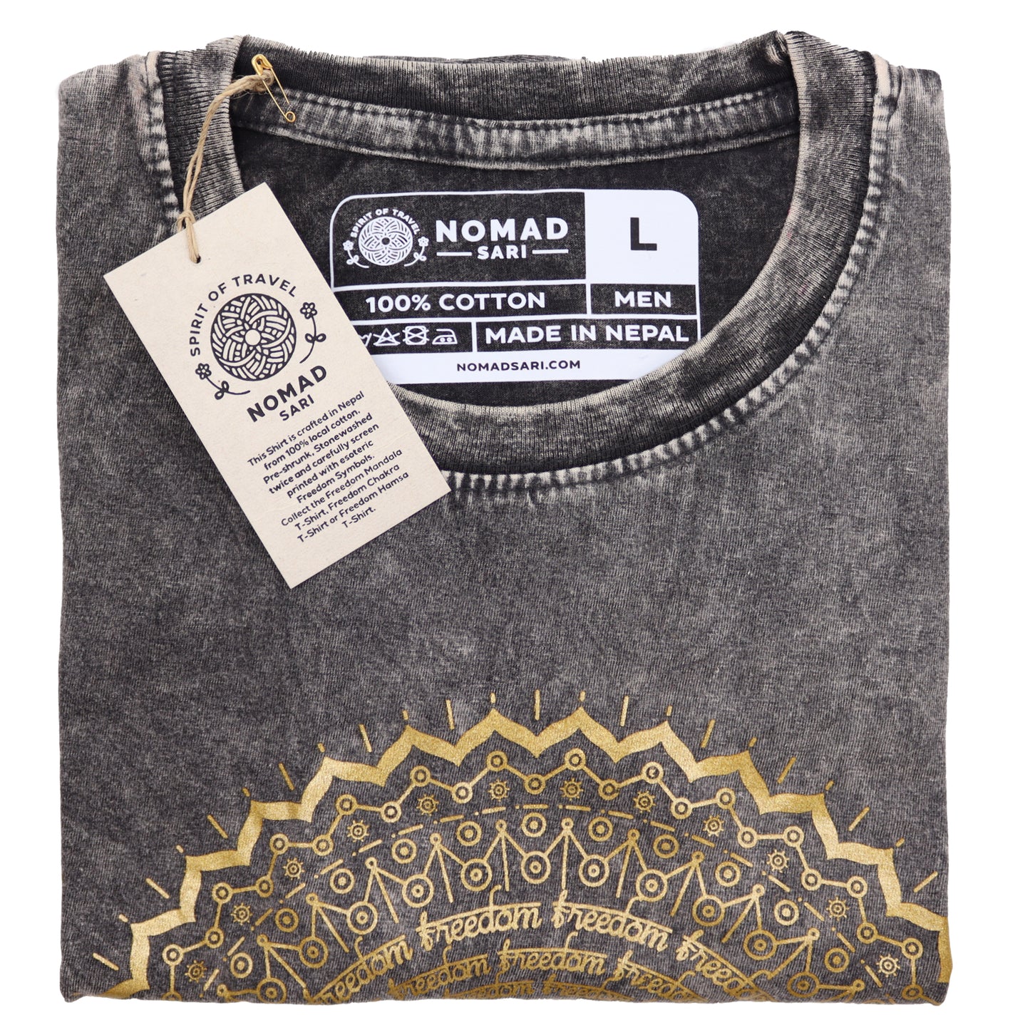 Folded black t-shirt with gold embroidery and 'Nomad Sari' label on a white background