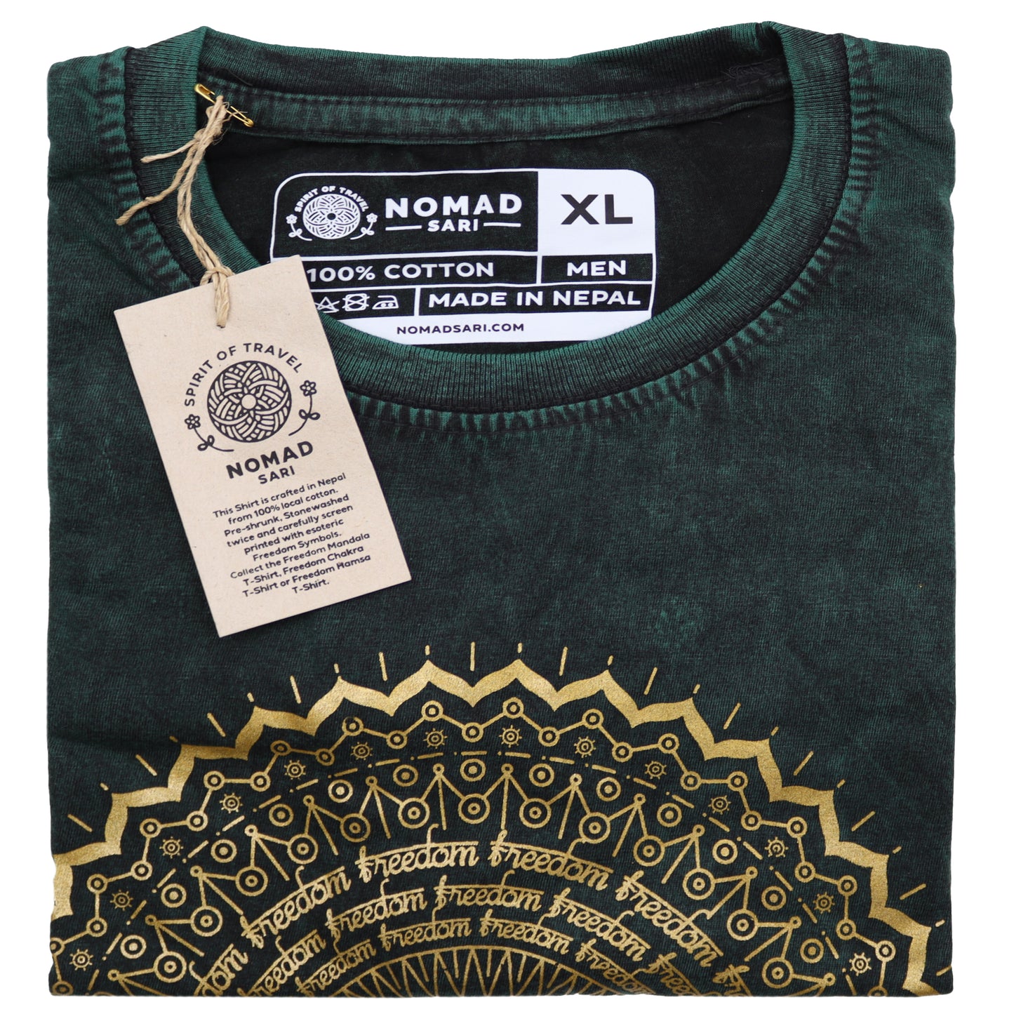 Folded green t-shirt with gold embroidery and 'Nomad Sar' label on a white background