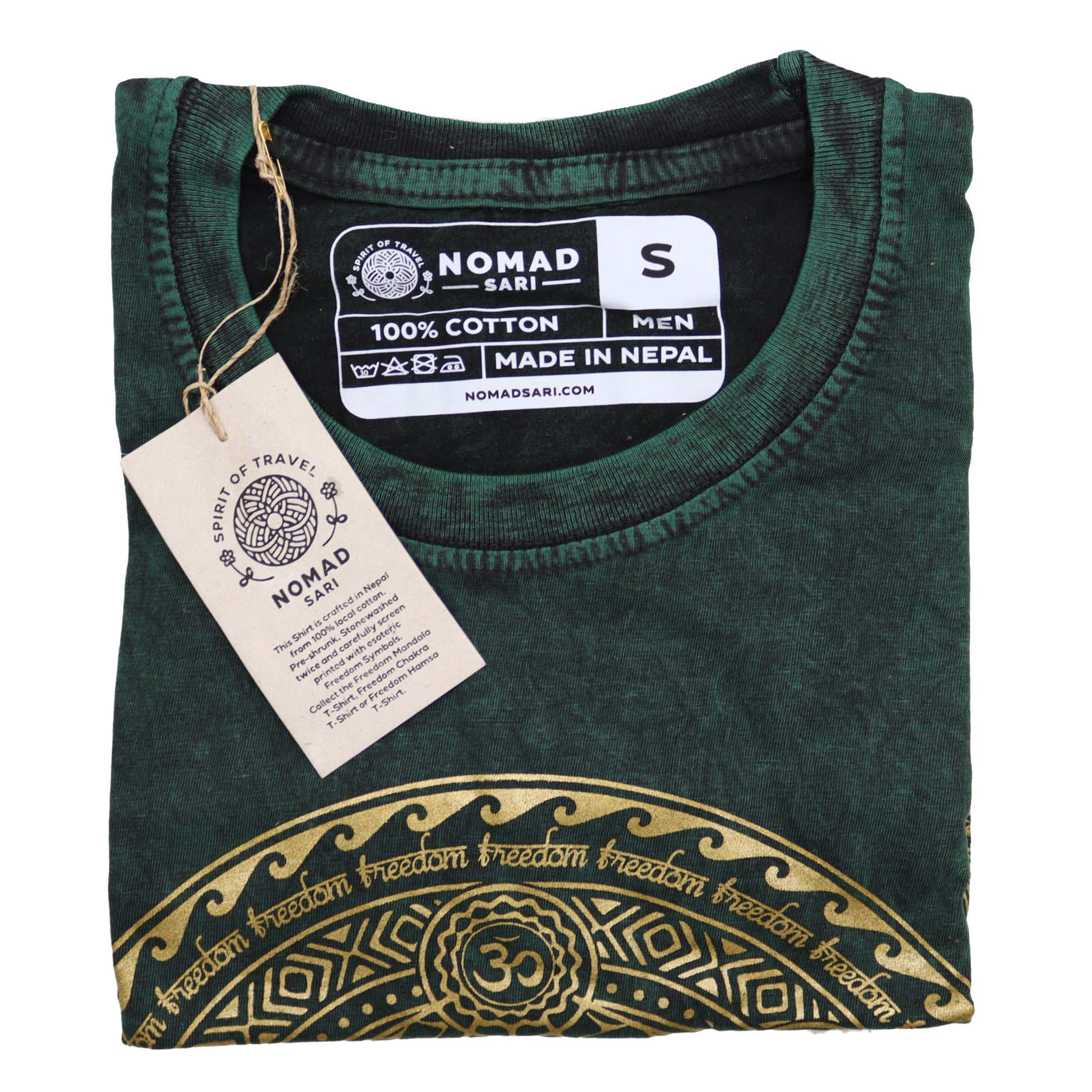 Folded green garment with gold embroidery and a tag on a white background