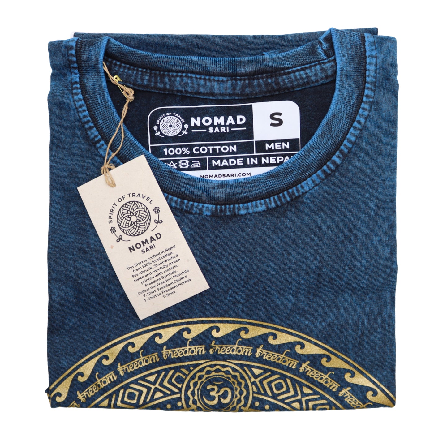 Folded blue t-shirt with gold design and 'Nomad Sari' tag on a white background