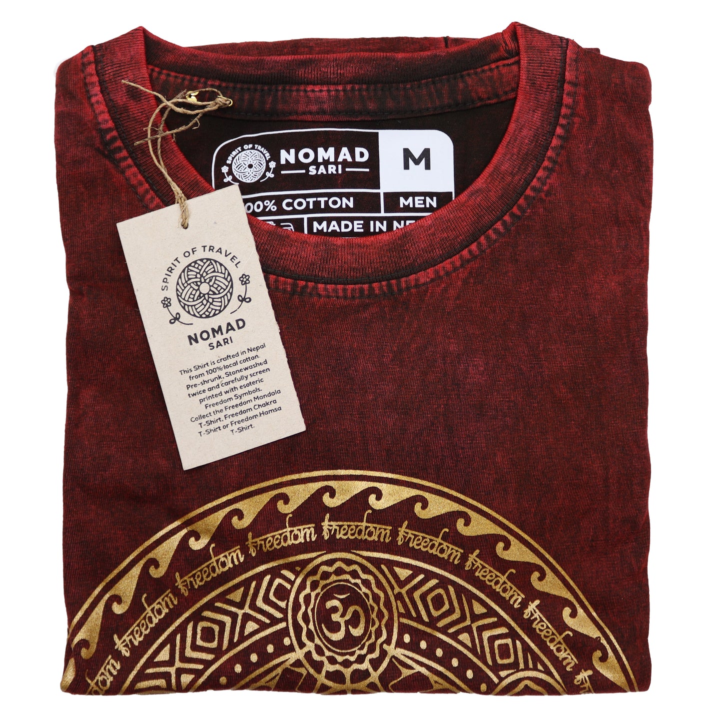 Folded red t-shirt with gold design and 'Nomad Sari' tag on a white background