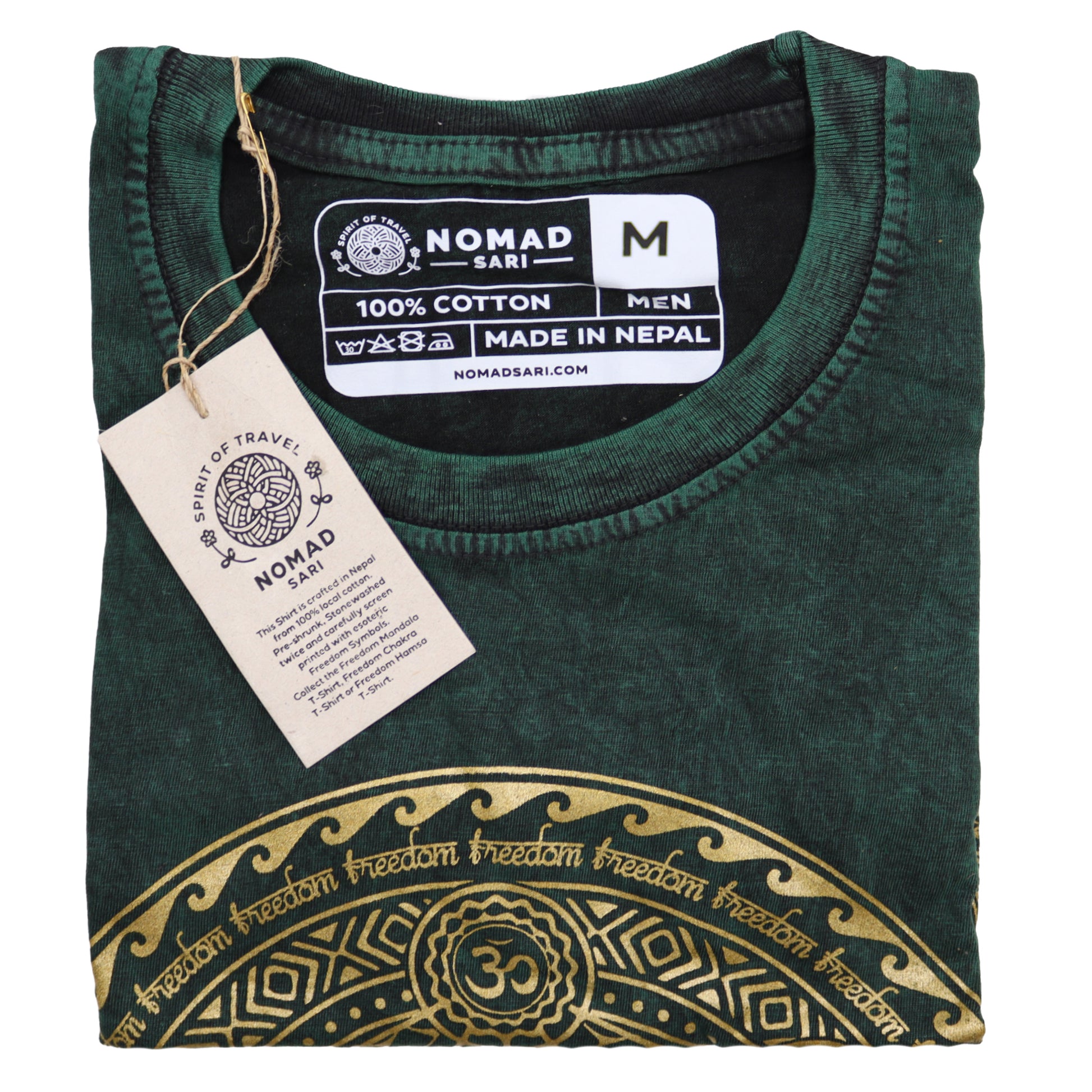 Folded green t-shirt with gold design and 'Nomad Sari' label on a white background