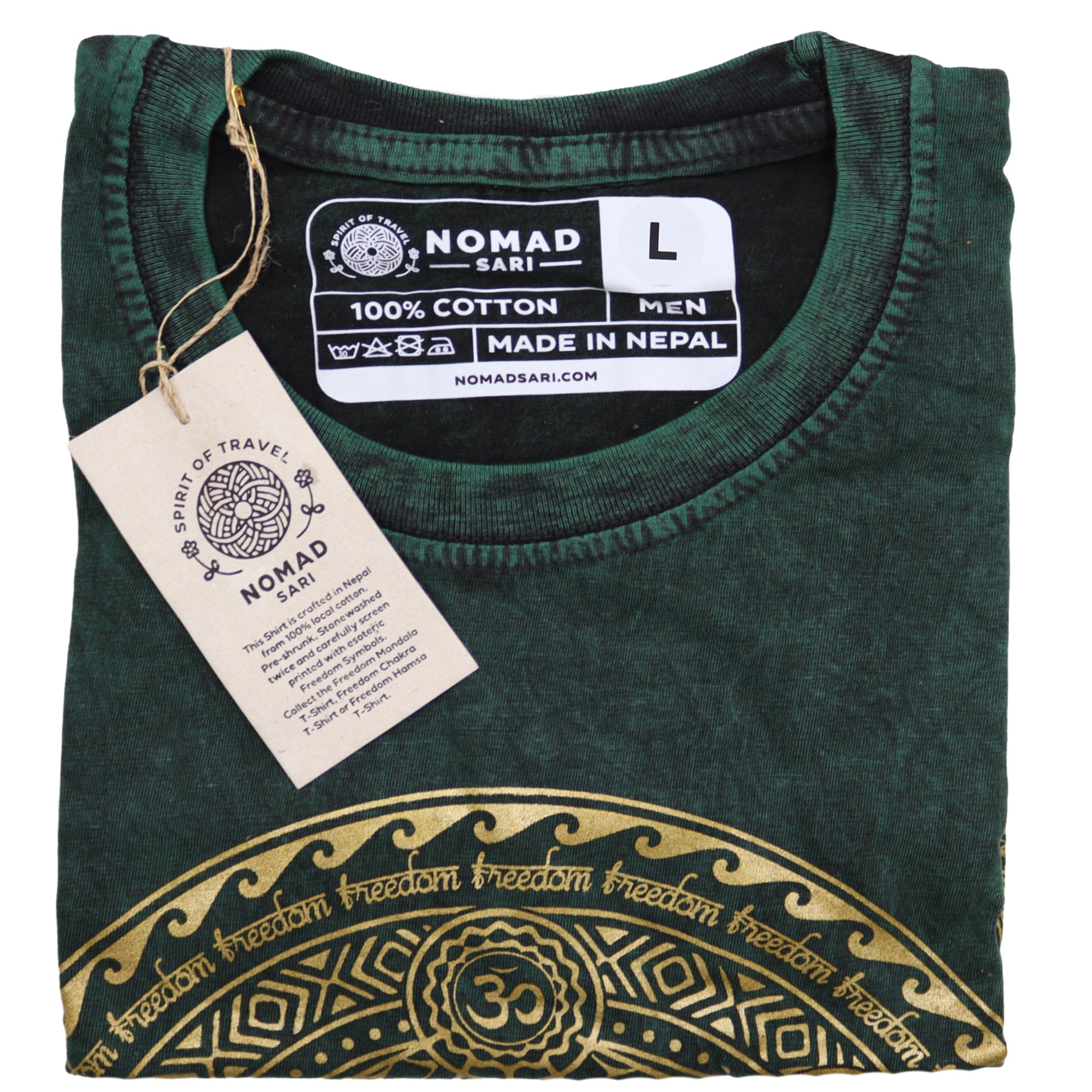 Folded green t-shirt with gold design and 'Nomad Sari' label on a white background