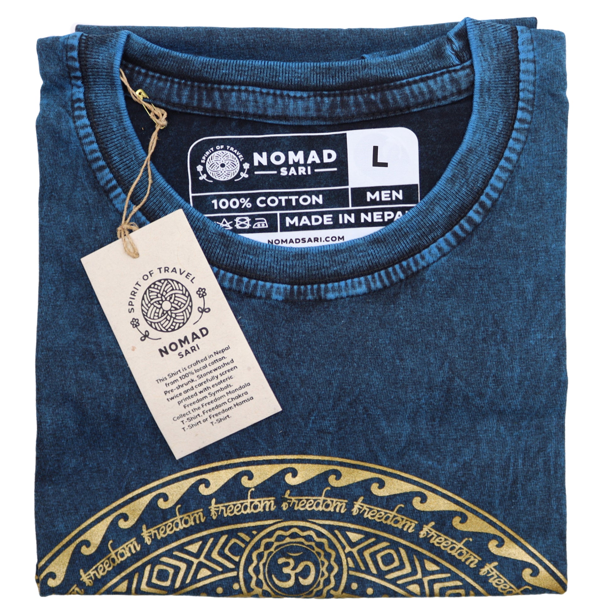 Folded blue t-shirt with gold design and Nomad Sari label on a white background