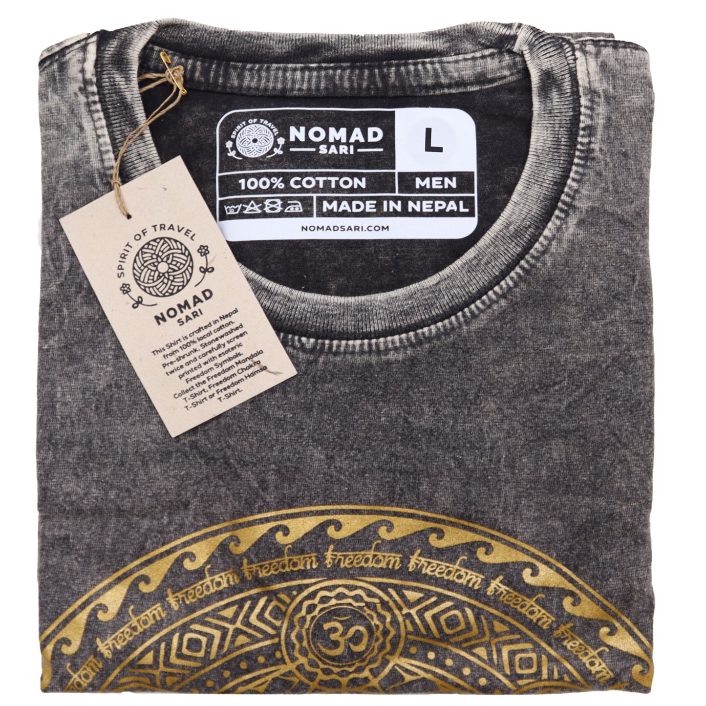 Folded black t-shirt with gold design and Nomad Sari label on a white background