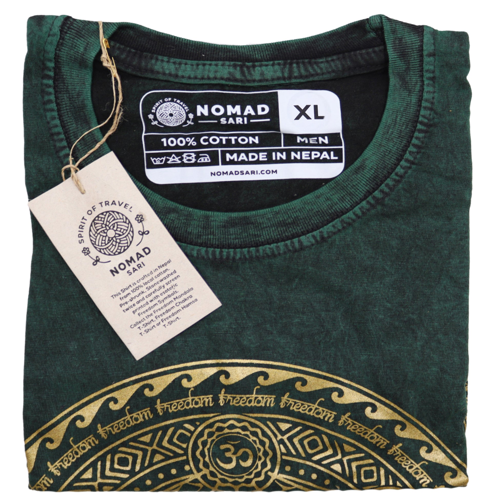 Folded green t-shirt with gold design and 'Nomad Sari' label on a white background