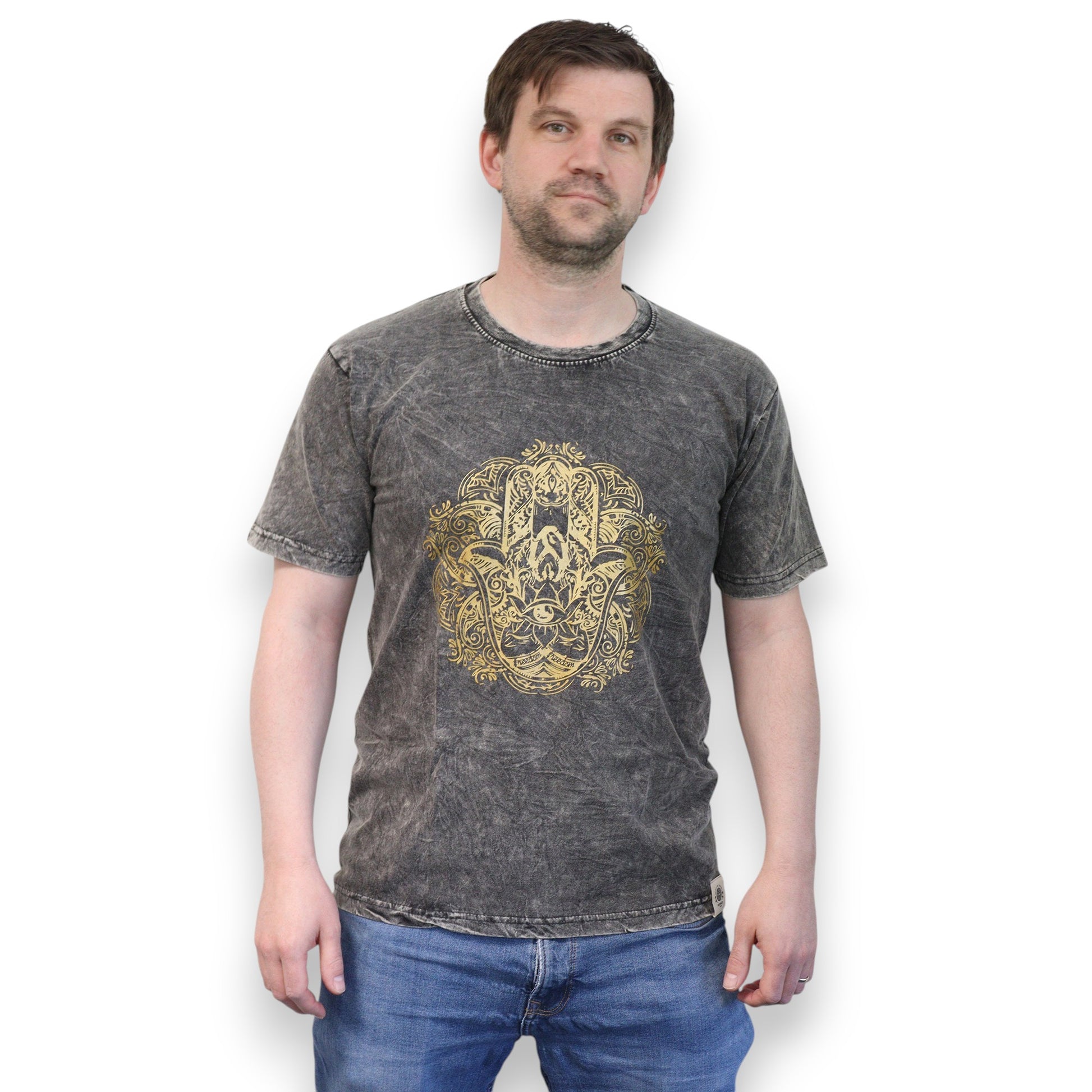 Man wearing a dark gray t-shirt with a gold hamsa graphic design on a white background