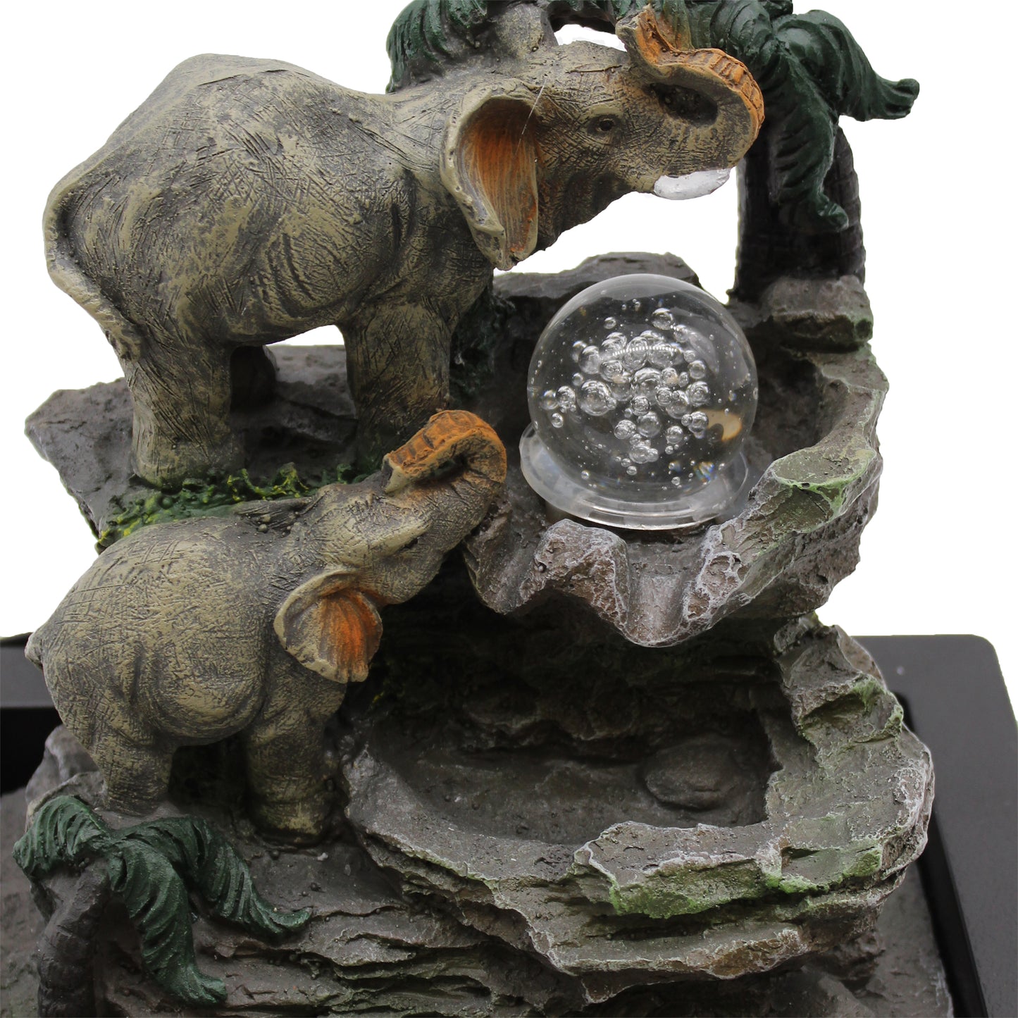close up view Tabletop Water Feature - 30cm - Elephant Family around a crystal ball on a rocky base.
