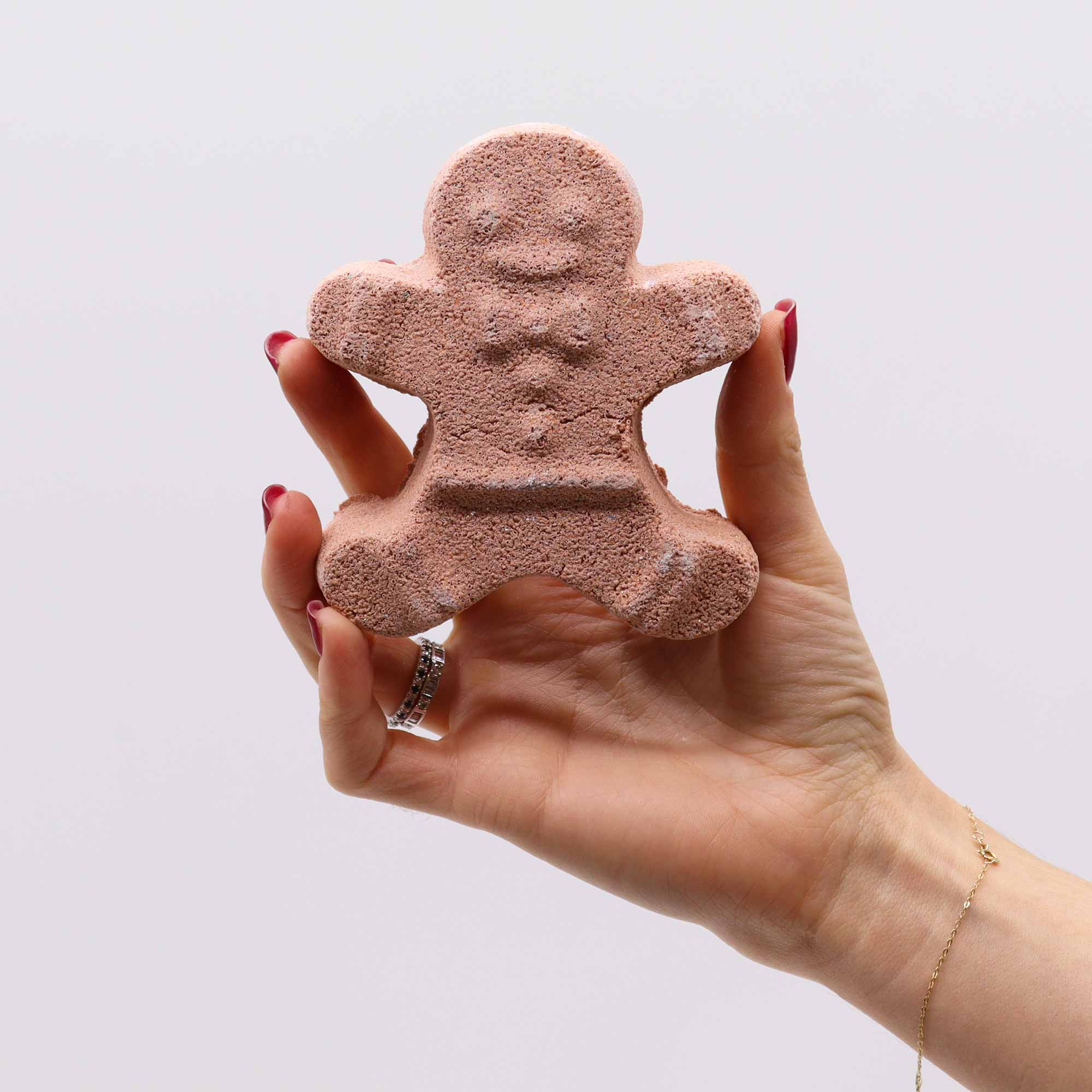 hand holding gingerbread man soap